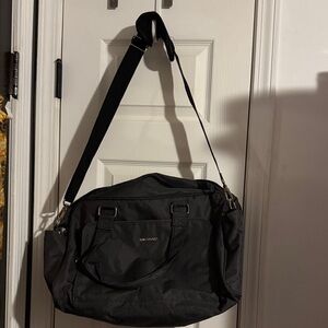 Grey Travel Bag. Has sleeve to go on top of roller suitcase